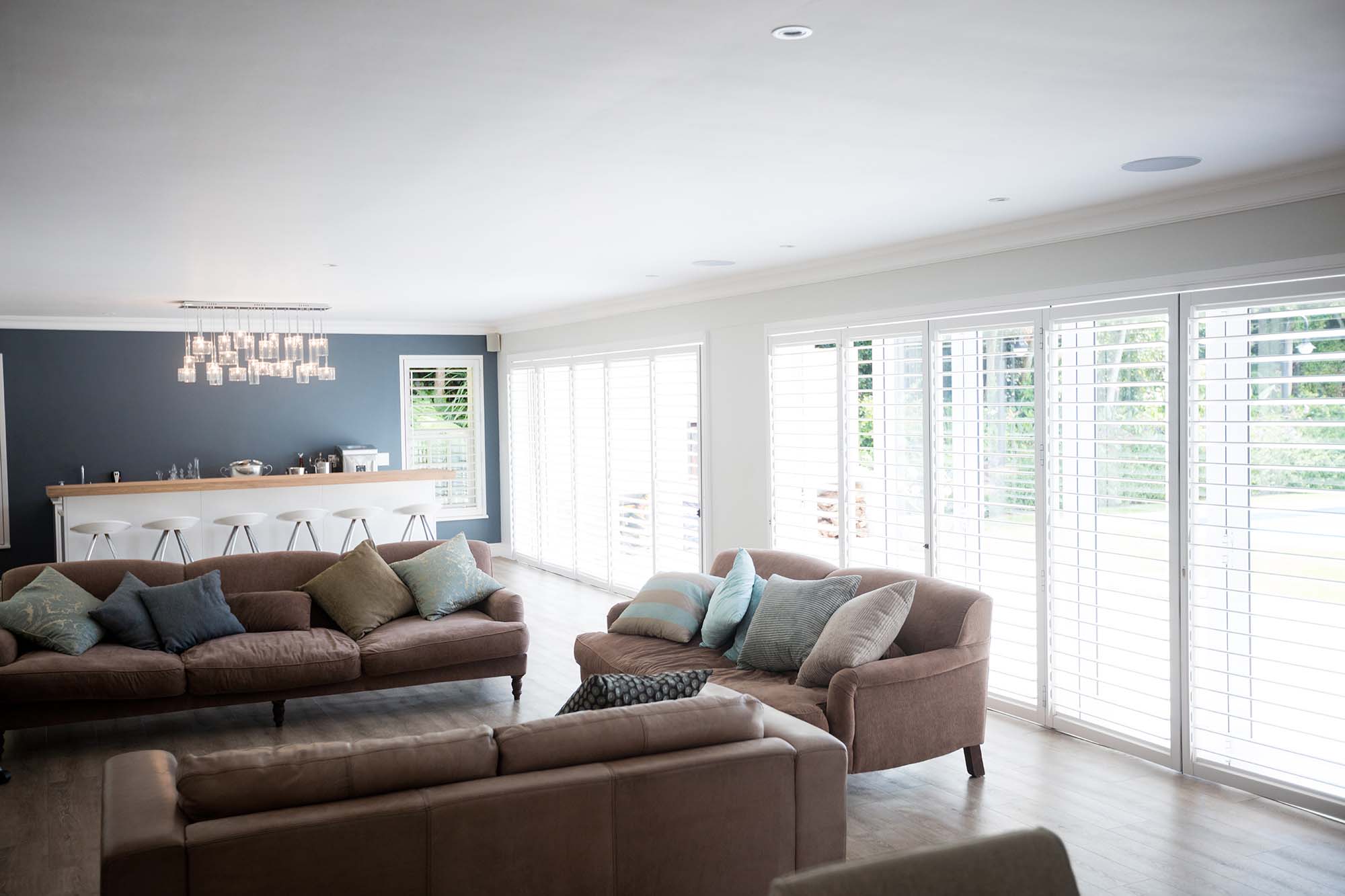 Shutters in living room allowing natural light in